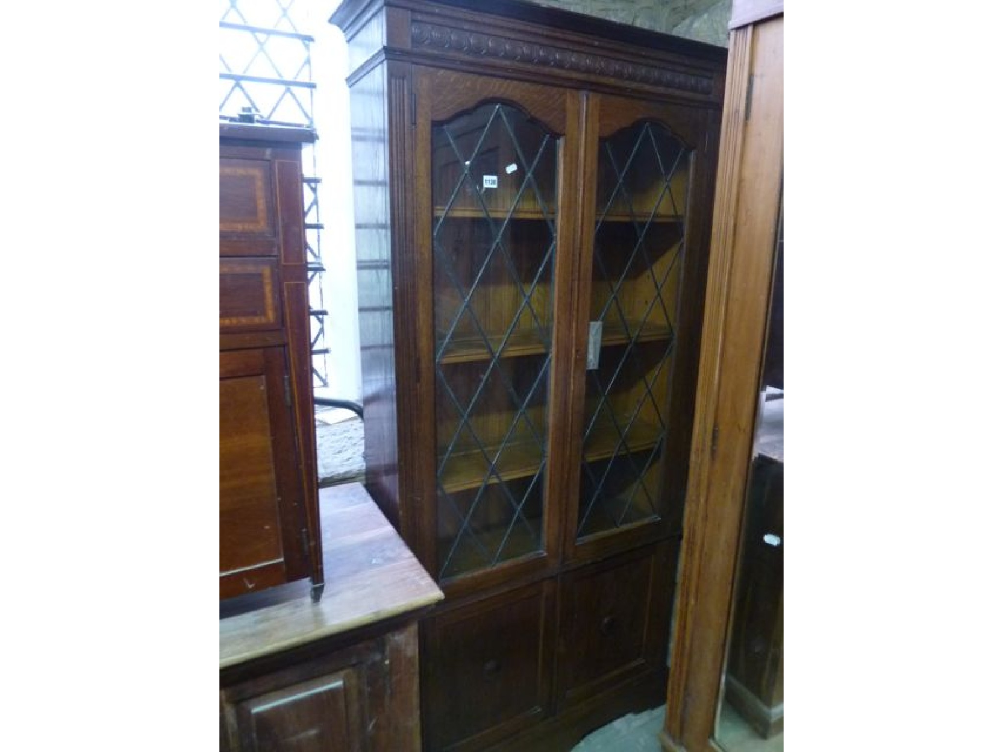 Appraisal: A s oak freestanding bookcase enclosed by two pairs of