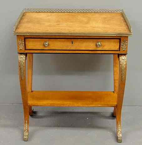 Appraisal: Regency satinwood table with brass gallery and ormolu mounts h