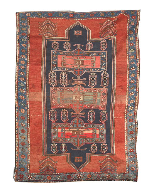 Appraisal: A KASAK RED GROUND RUG the central blue ground panel