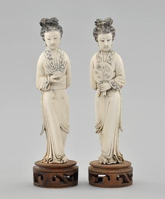 Appraisal: A Pair of Carved Ivory Figurines of Maidens with Fans