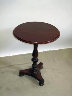 Appraisal: A MAHOGANY LAMP TABLE the moulded edged circular top on