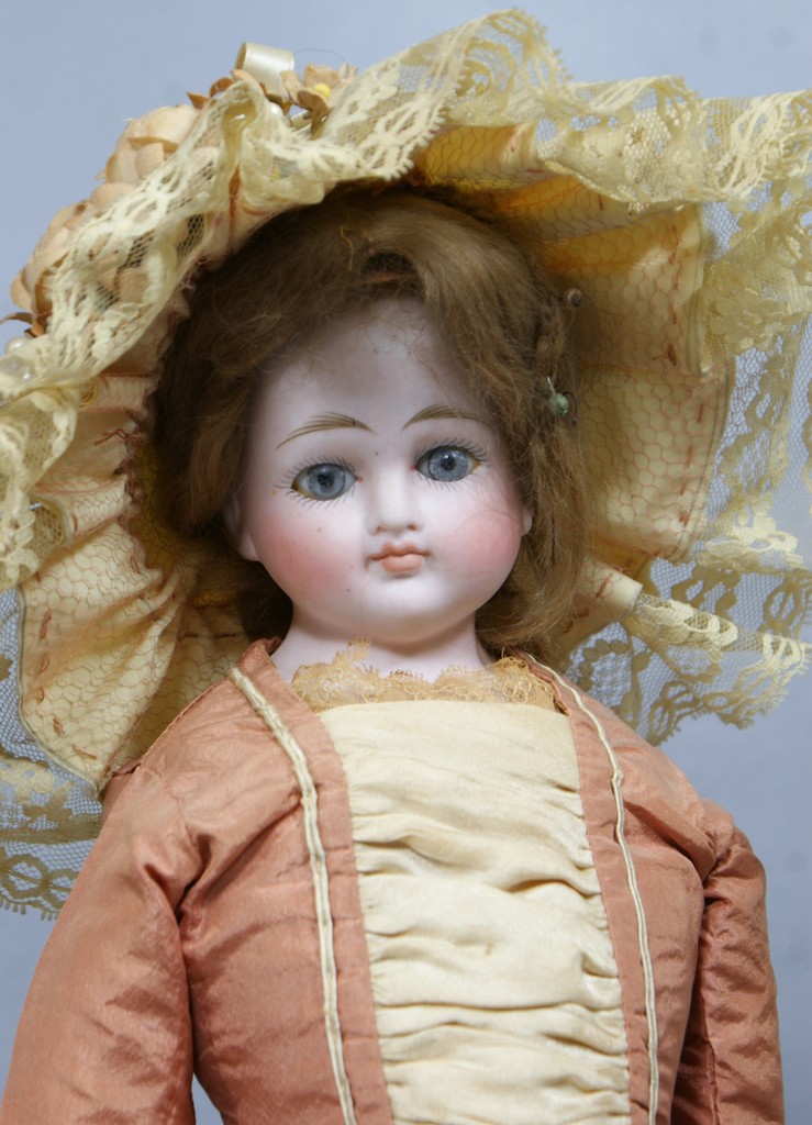 Appraisal: Closed Mouth German Bisque Shoulder Head Fashion Doll unmarked solid