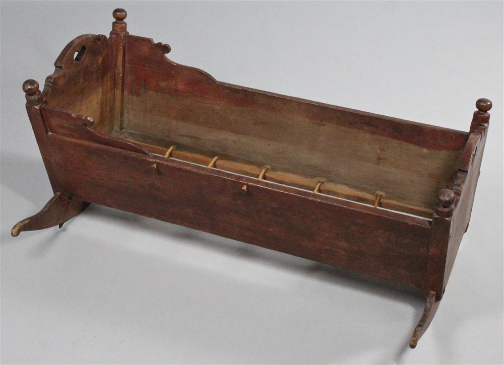 Appraisal: RED PAINTED TURNED BABY CRADLE TOGETHER WITH A CARVED MAHOGANY