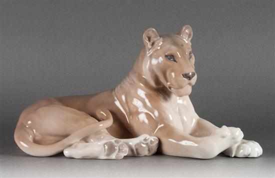 Appraisal: Royal Copenhagen porcelain recumbent lioness figure in H in L