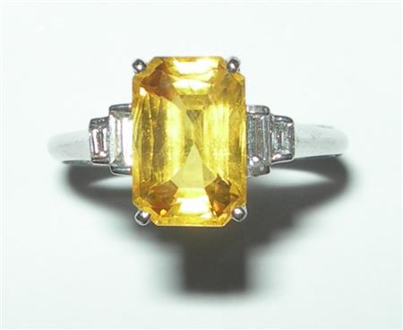 Appraisal: An Art Deco style yellow sapphire and diamond set ring