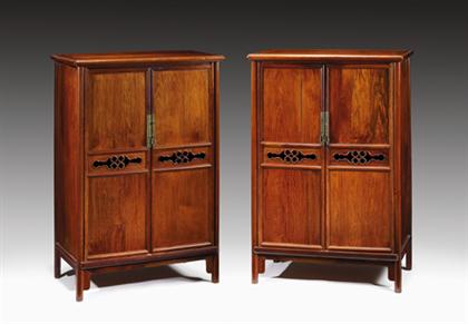 Appraisal: Pair of Chinese huanghuali round corner tapering kang cabinets yuanjiao