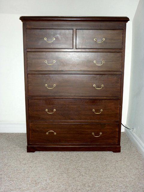 Appraisal: A modern rosewood chest of four long and two short