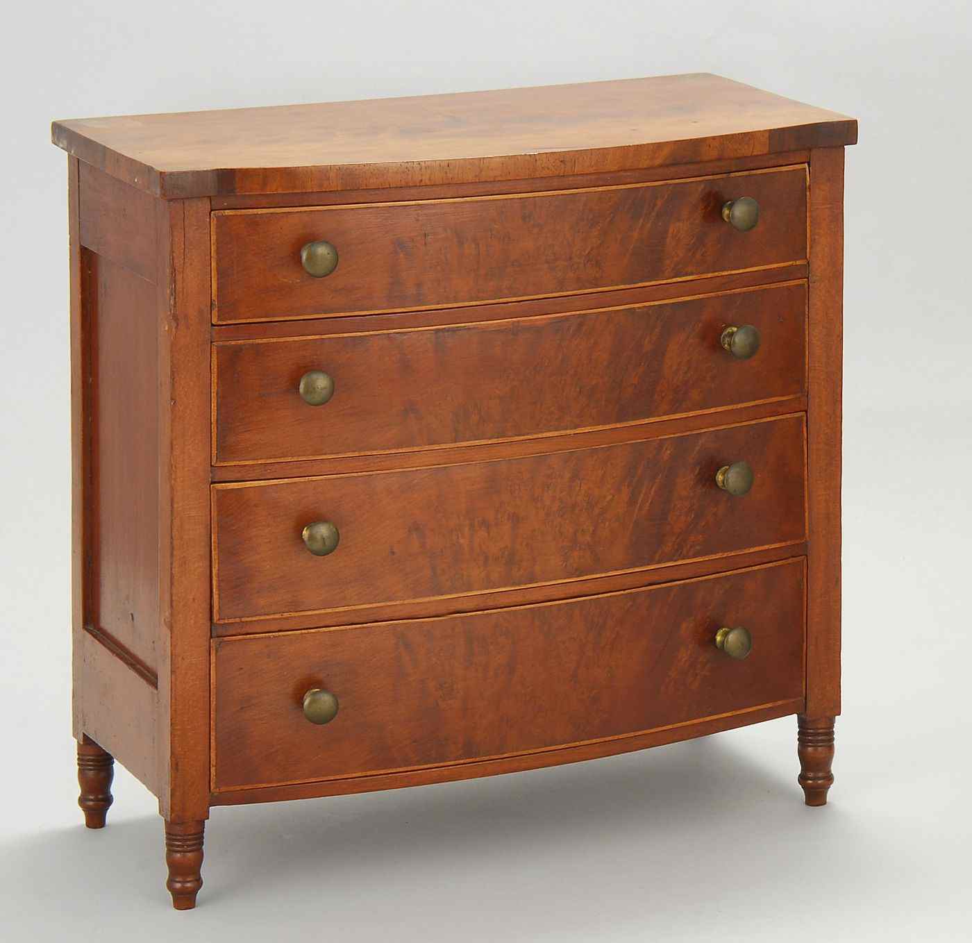 Appraisal: ANTIQUE AMERICAN SHERATON CHILD'S FOUR-DRAWER BOWFRONT BUREAUFirst Quarter of the