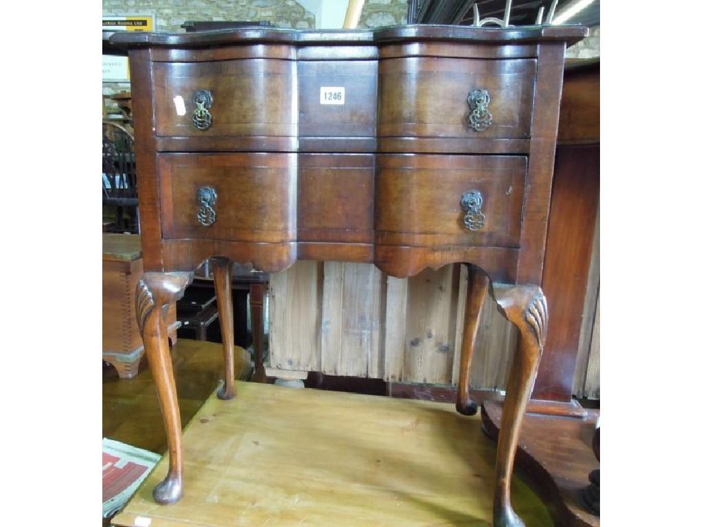 Appraisal: A small Georgian style walnut side table with serpentine front