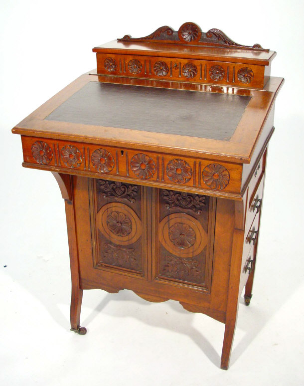 Appraisal: Aesthetic walnut Davenport with pen tray above a fall enclosing