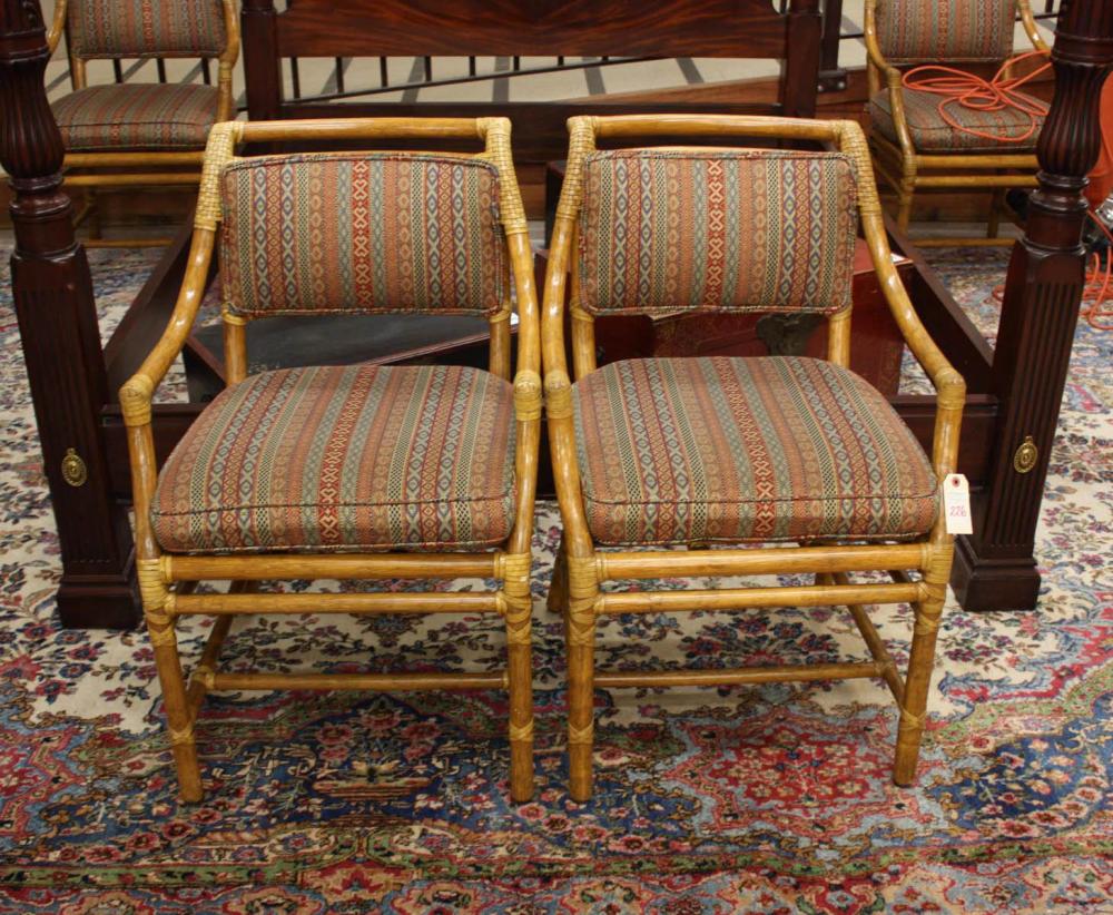 Appraisal: A SET OF FOUR MCGUIRE RATTAN ARMCHAIRS McGuire Furniture Co