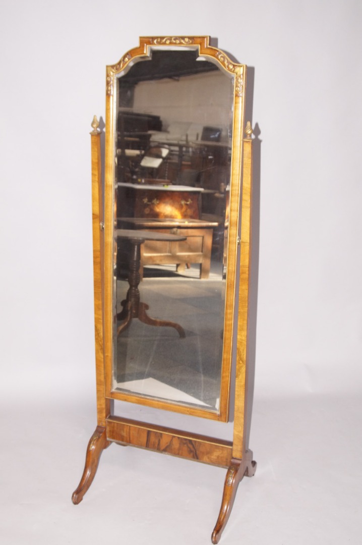 Appraisal: An thC style walnut framed bevel framed cheval mirror with