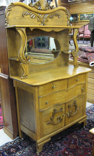 Appraisal: LATE VICTORIAN OAK SIDEBOARD American late th century The top