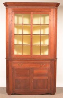 Appraisal: Pennsylvania Federal Cherry Two Part Corner Cupboard Molded cornice with