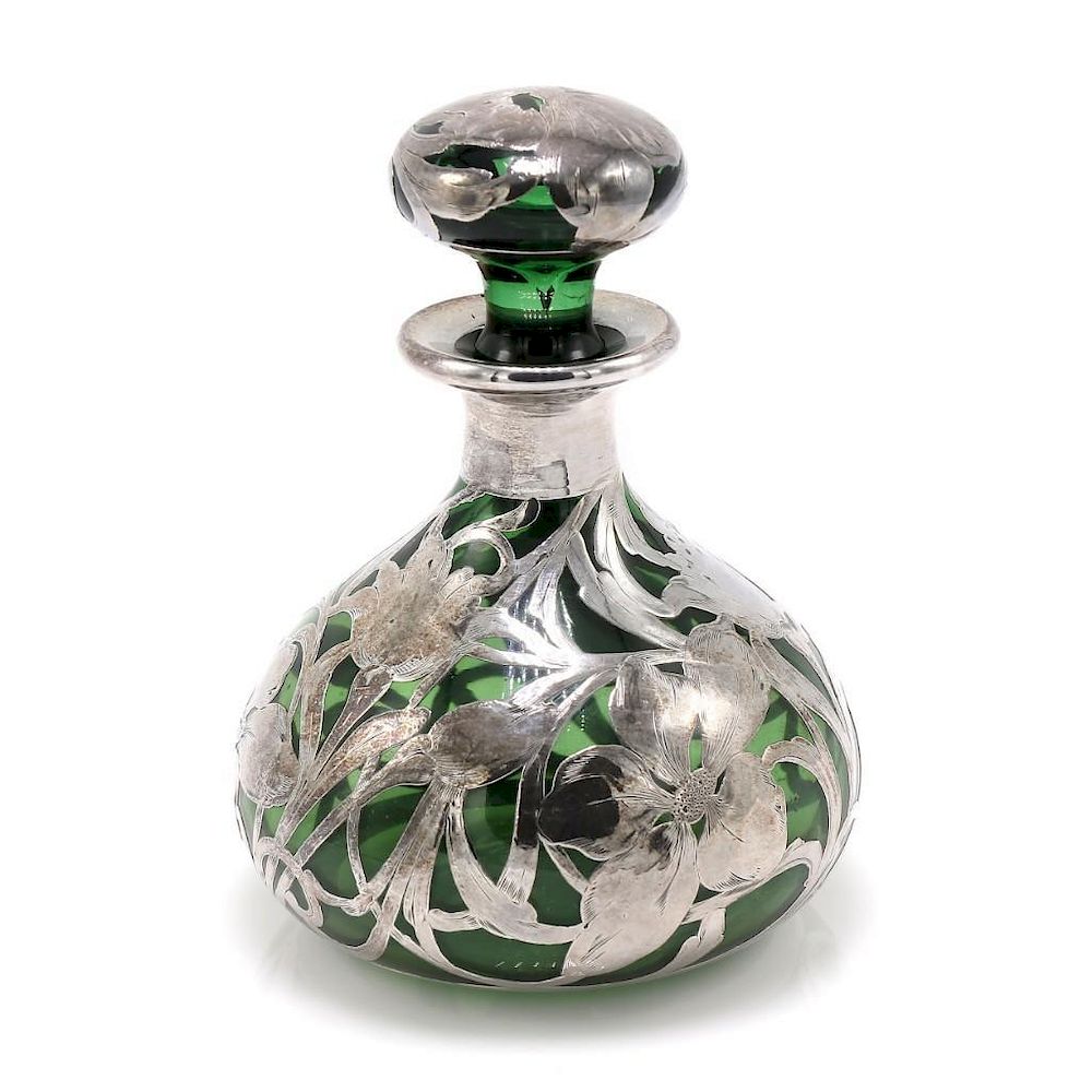 Appraisal: Green Perfume Bottle with Silver Overlay Green perfume bottle featuring