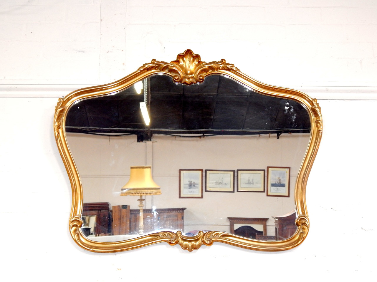 Appraisal: A giltwood wall mirror modern of rococo form cm x