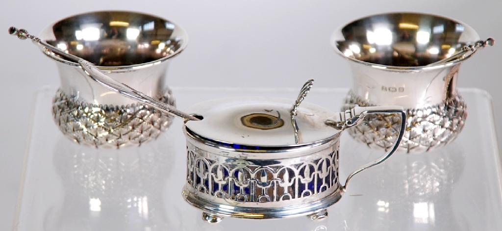 Appraisal: PAIR OF EDWARDIAN SILVER SALT CELLARS of thistle form with