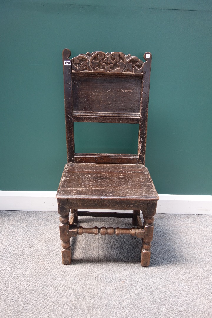 Appraisal: A late th century oak panel back side chair with