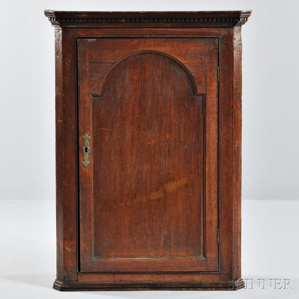 Appraisal: English Oak Hanging Cupboard th century hinged tombstone panel door