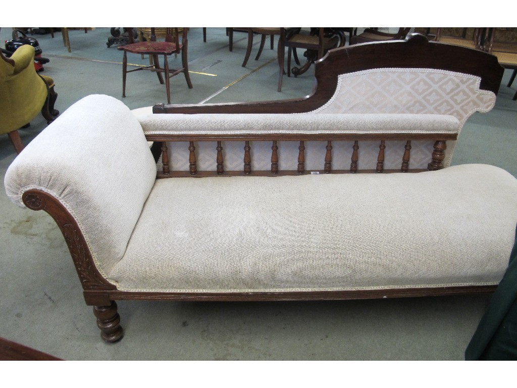 Appraisal: A Victorian oak framed chaise longue upholstered in a cream