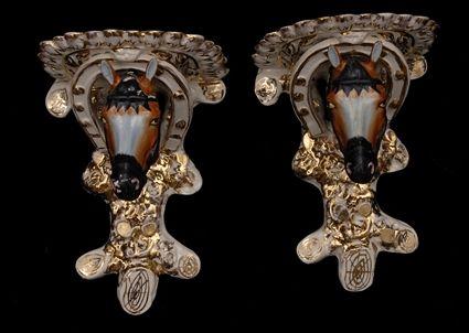 Appraisal: PAIR OF STAFFORDSHIRE HORSE-HEAD WALL BRACKETS Each gilt-edged lobed shelf