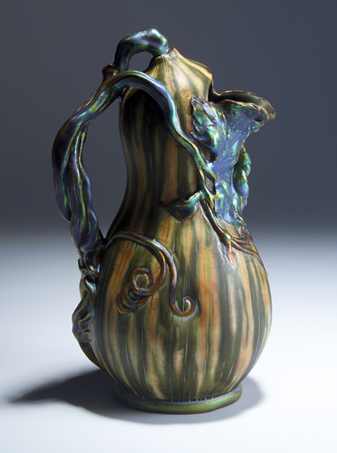 Appraisal: ZSOLNAY Gourd-shaped pitcher with modeled vine handle and draped leaves