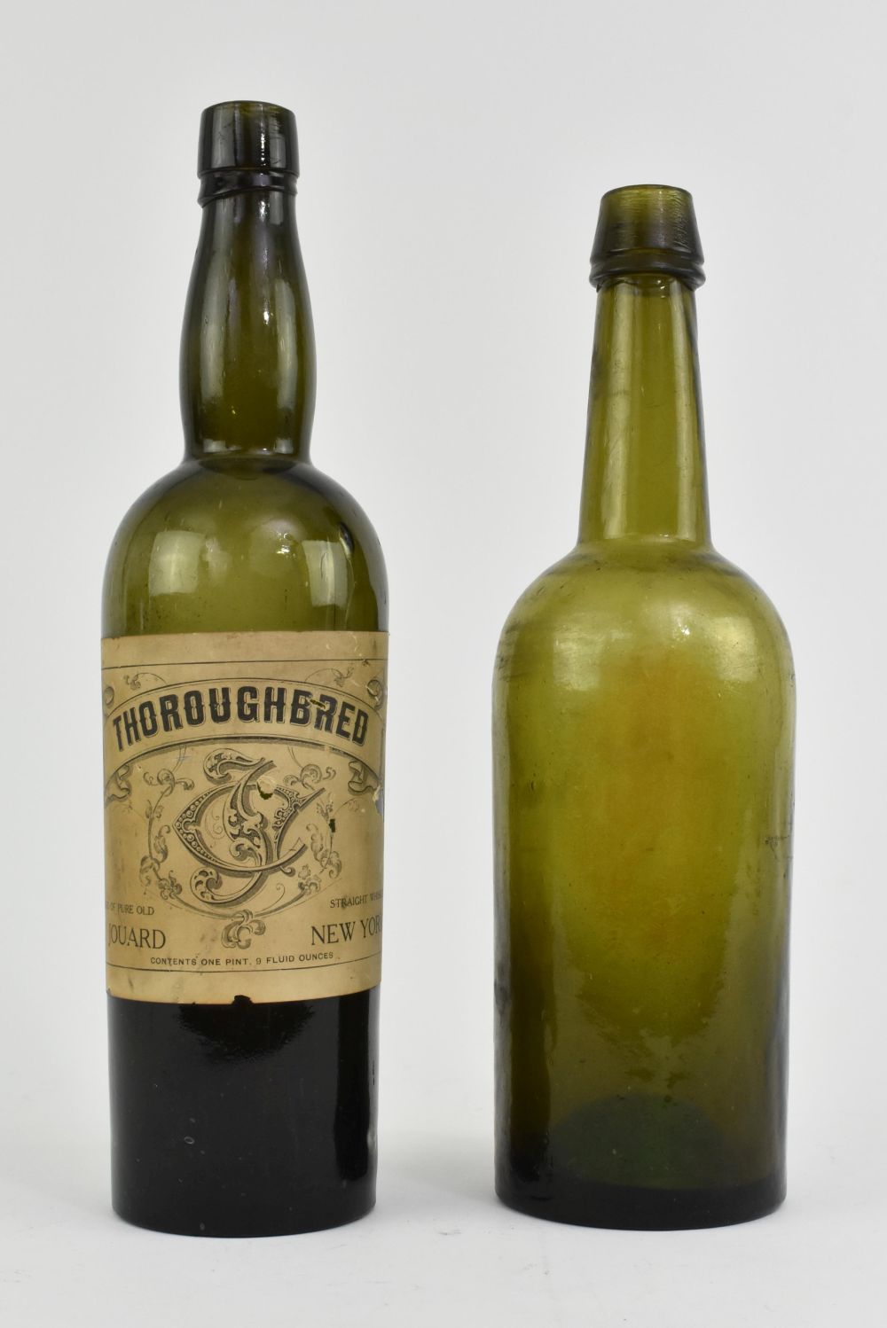 Appraisal: TWO AMERICAN BOTTLE GREEN GLASS ALE BOTTLESCirca The underside marked