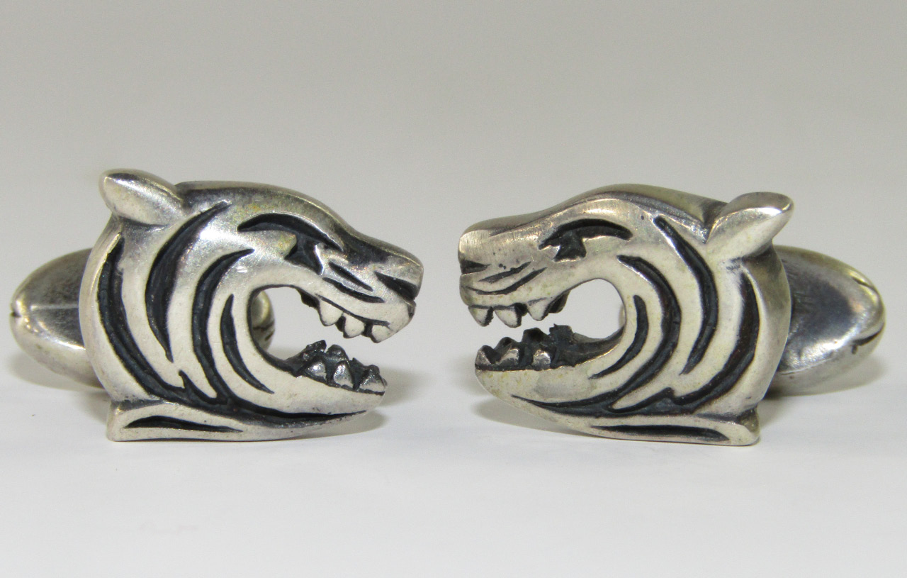 Appraisal: A pair of cufflinks with Leicester Tigers' Tiger's head motifs