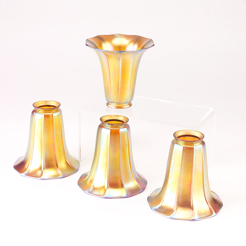 Appraisal: STEUBEN Set of four gold Aurene glass trumpet lamp shades