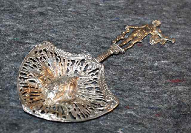 Appraisal: A CONTINENTAL SPOON with a shield shaped bowl pierced and