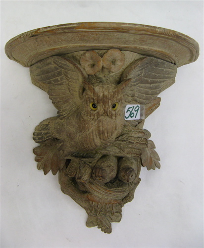 Appraisal: CARVED WOOD FIGURAL WALL SHELF having an owl with nesting