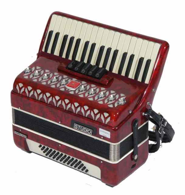 Appraisal: A BAI-LE BALLERINA STUDIO ACCORDION with red pearlescent finish in