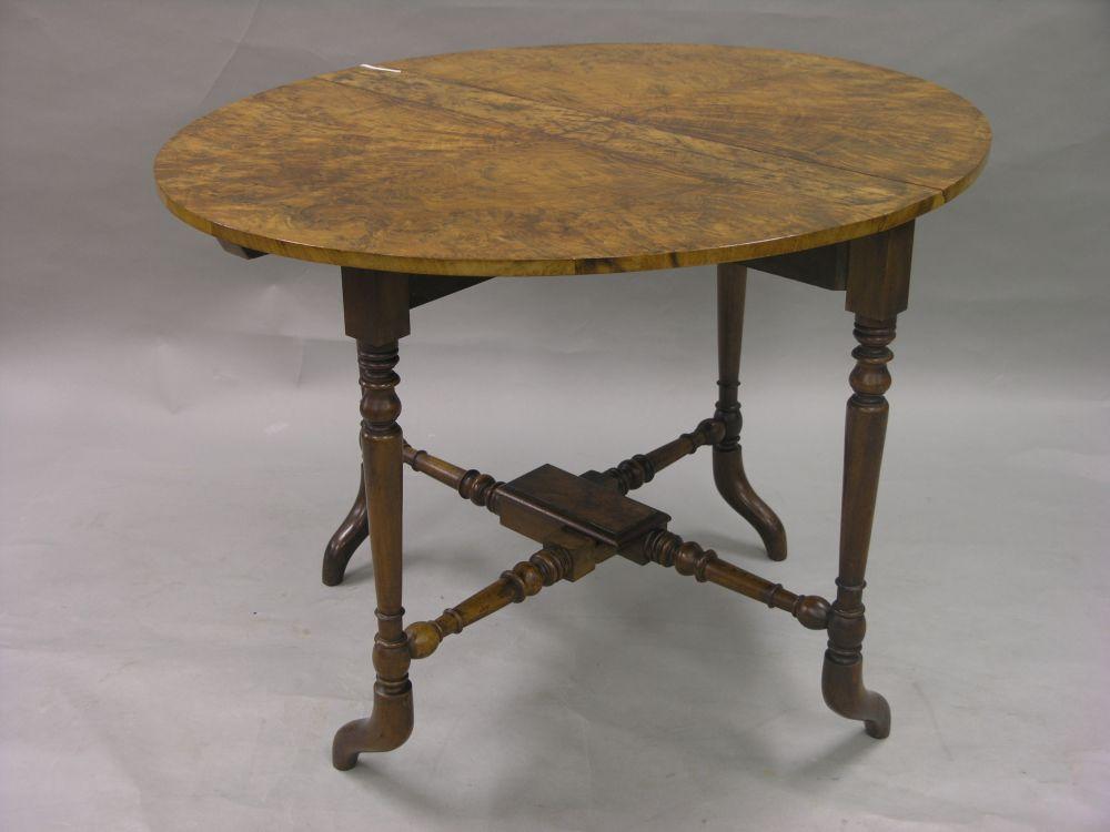 Appraisal: A good Victorian burr walnut veneered Sutherland table with quarter-veneered