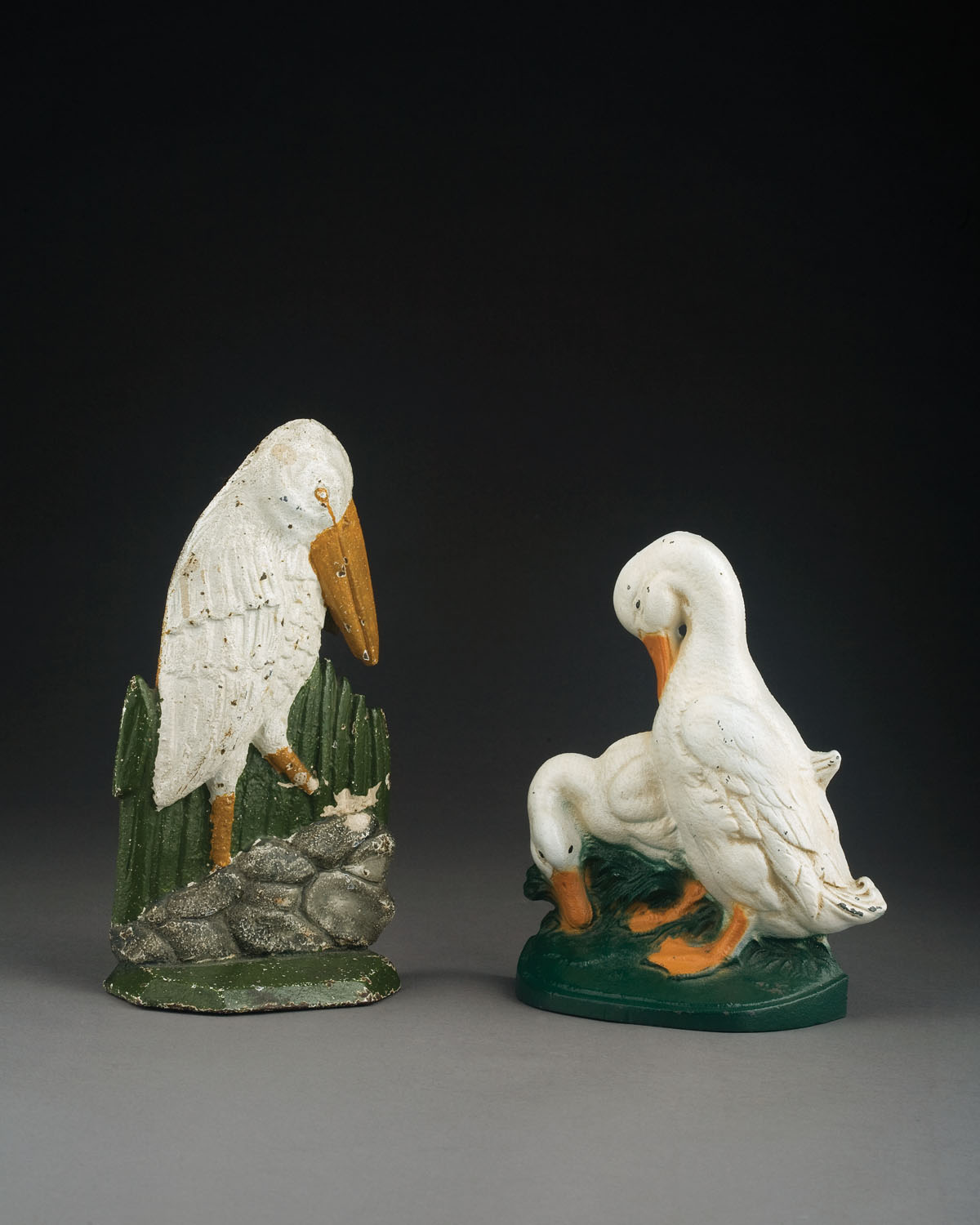 Appraisal: TWO AMERICAN PAINTED CAST-IRON FIGURAL DOORSTOPS TWENTIETH CENTURY Each painted