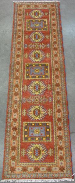 Appraisal: Handmade Oriental Runner Kazak design red field with yellow and