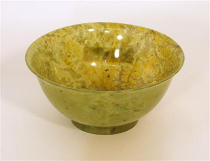 Appraisal: Chinese dark green jadeite bowl Of graduated U-shape slightly everted