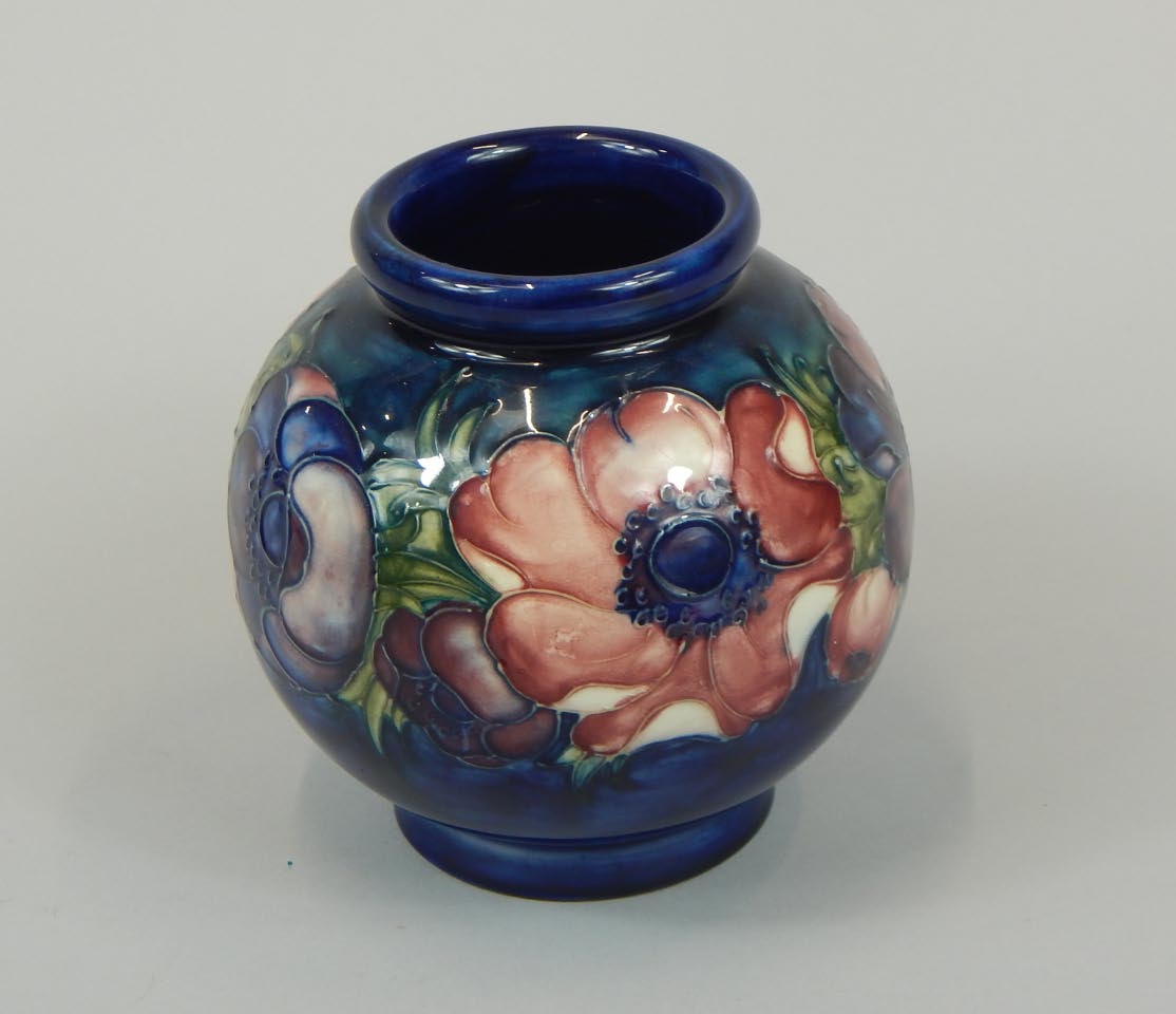 Appraisal: A Moorcroft globular vase decorated with a tube line band