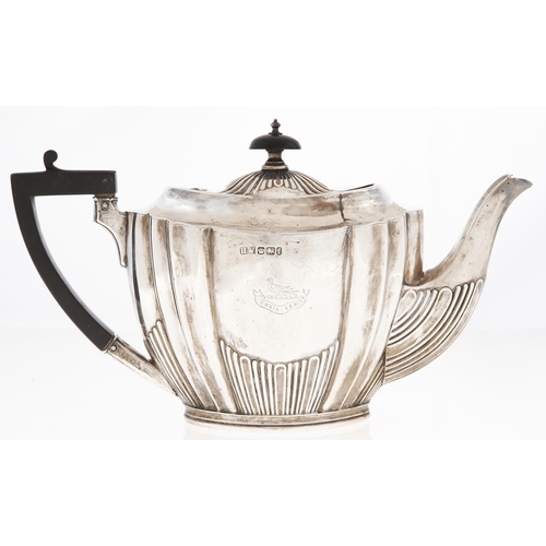 Appraisal: A Victorian silver teapot of fluted oval shape crested cm