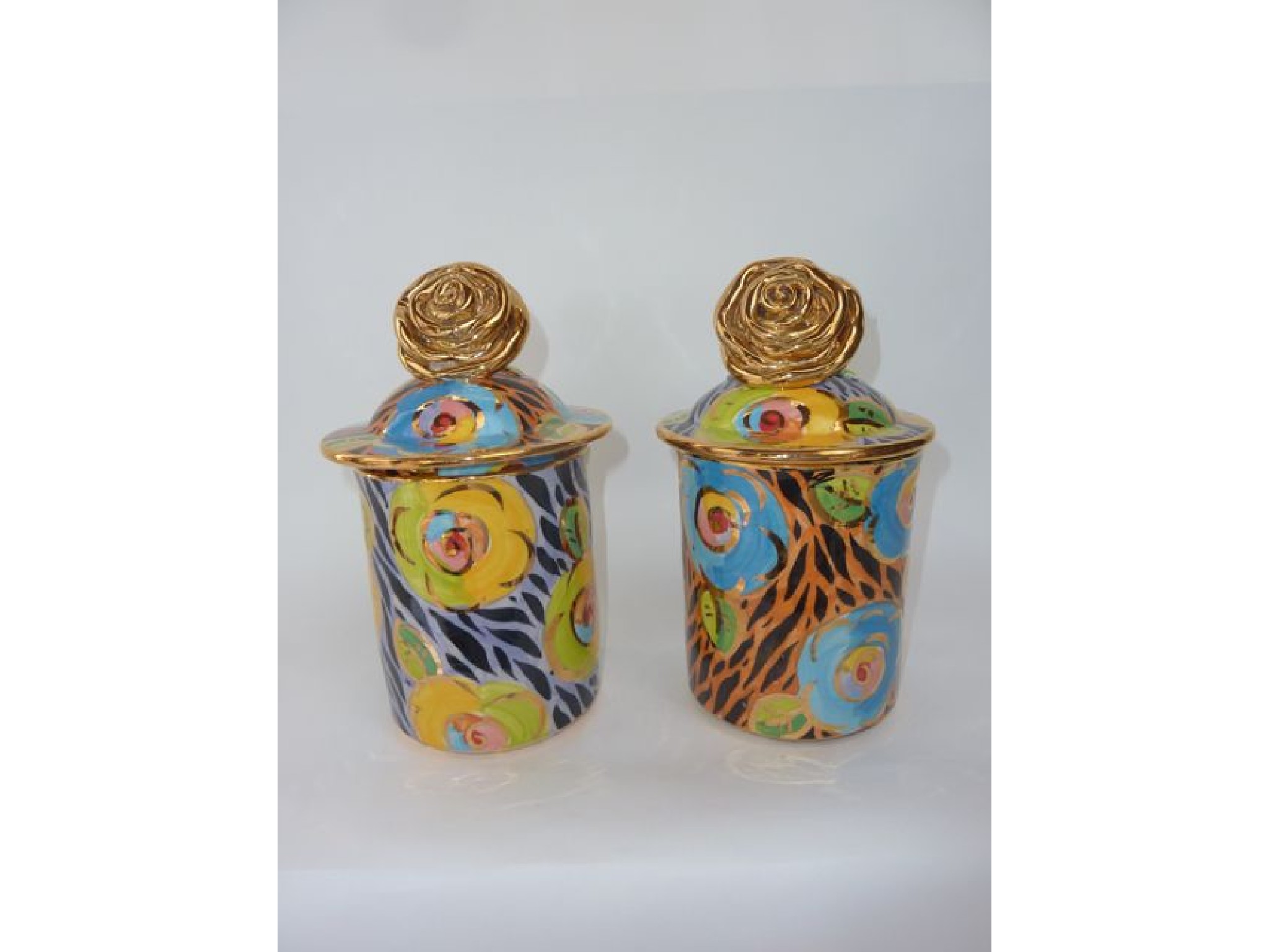 Appraisal: A pair of cylindrical Studio Pottery pots and covers by