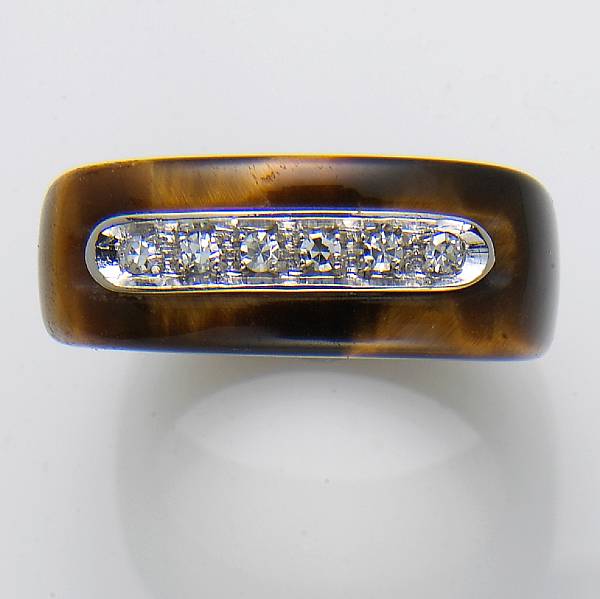 Appraisal: A tiger's eye diamond and k gold ring Salavetti size