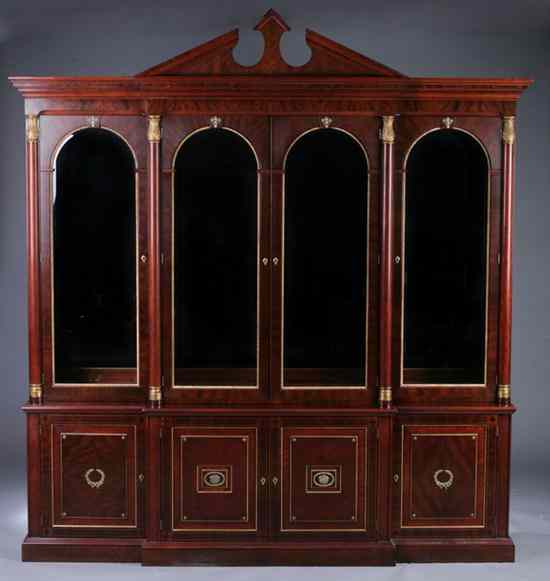 Appraisal: ITALIAN STYLE PARCEL-GILT MAHOGANY BREAKFRONT CHINA CABINET Upper section broken