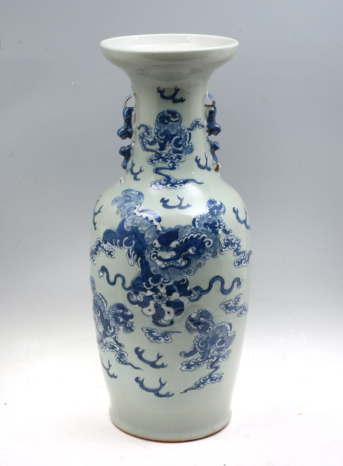 Appraisal: TALL CHINESE BLUE AND WHITE FOO DOG VASE Celadon glazed