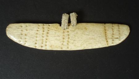 Appraisal: An ethnographic bone ornament Possibly a brow band from Thule