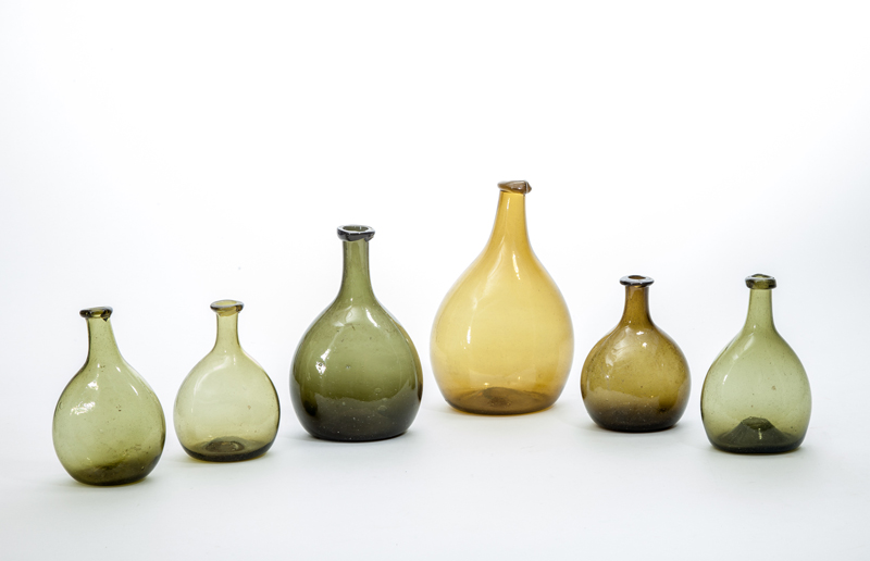 Appraisal: GROUP OF SIX BLOWN GREEN GLASS BALLOON-SHAPED BOTTLES to in