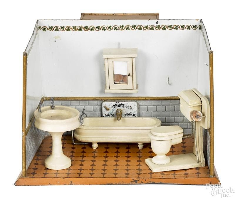 Appraisal: German embossed painted tin toy bathroom German embossed painted tin