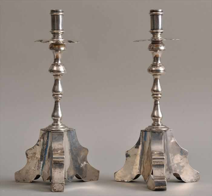 Appraisal: PAIR OF SPANISH COLONIAL BAROQUE-STYLE SILVER CANDLESTICKS Each segmented stem