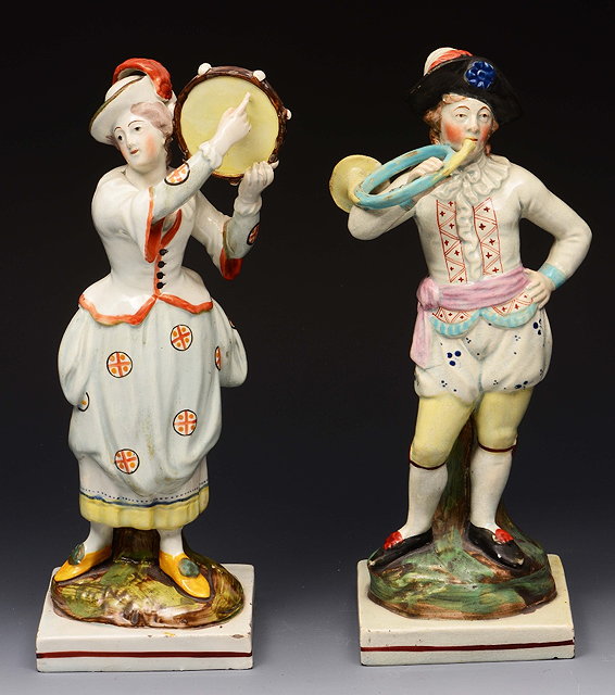 Appraisal: A PAIR OF ENGLISH PEARL WARE FIGURES of a boy