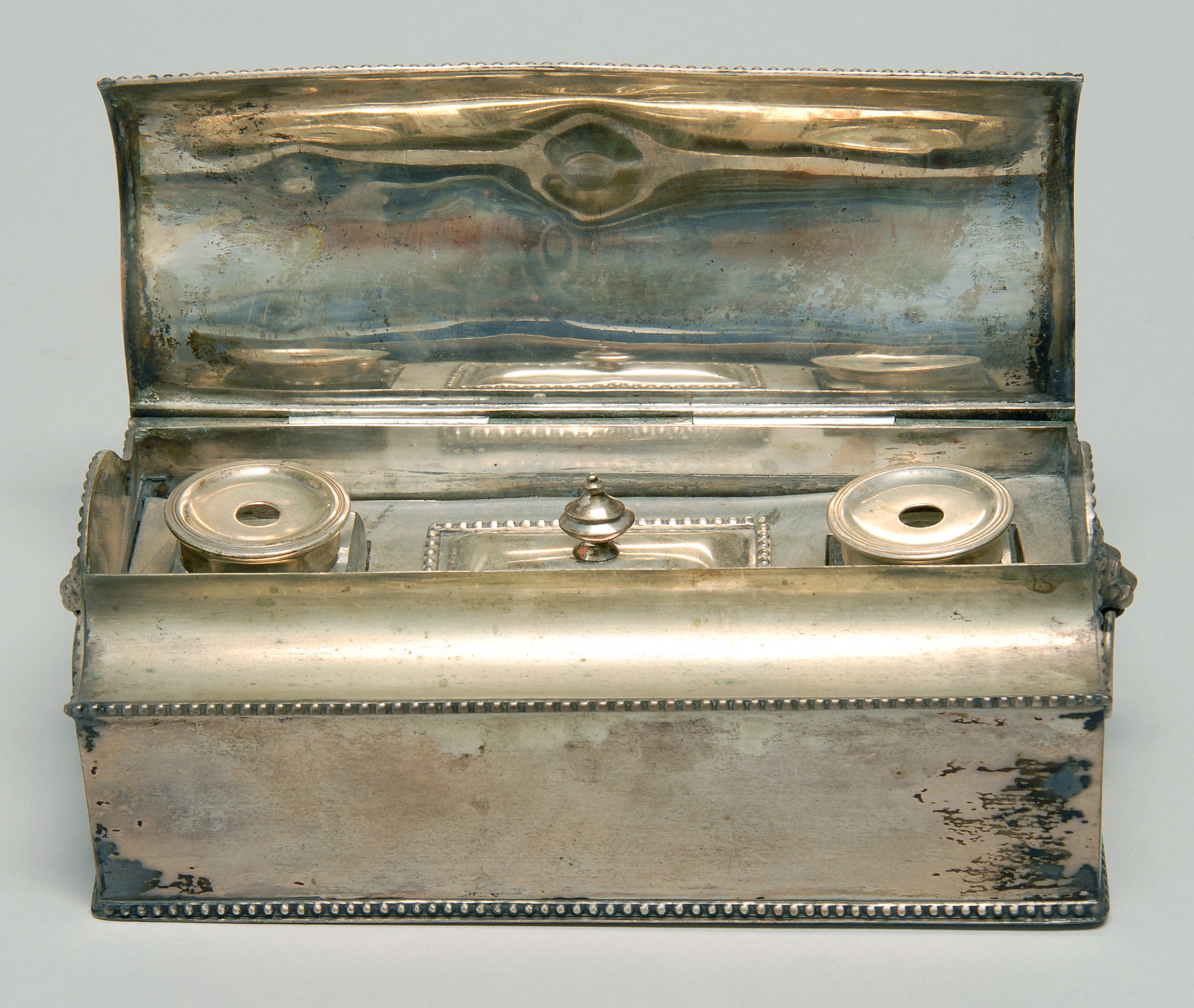 Appraisal: SILVER PLATED STANDISH th CenturyWith lift top concealing inkwells and