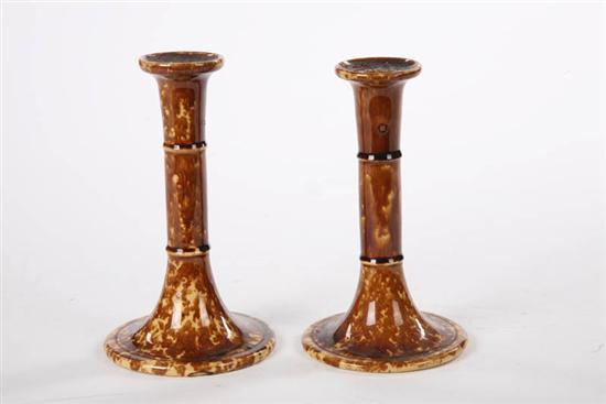 Appraisal: TWO BENNINGTON CANDLESTICKS Cylindrical form with two rings on circular