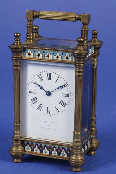 Appraisal: A VICTORIAN BRASS AND CHAMPLEVE CARRIAGE CLOCK with a white